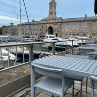 Outside seating overlooking harbour, yachts and sea views at Wagamama in Plymouth