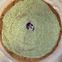 Vegetable saffron stew top with parsley crème covered pastryy  at Like An Elephant in Lyon