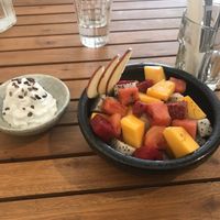 Seasonal fruit with coconut cream (dragon fruit, apple, papaya, watermelon)  at Brew and Breakfast in Da Lat