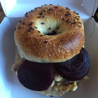 Vegan bagel with hummus beets and walnuts at Beigelistai  in Vilnius