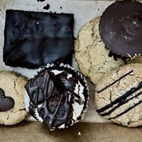 Pictured, left to right: peanut butter special, fudge brownie, brownie cupcake, chocolate chunk cookie, almond butter drizzle cookie, peanut butter cup.  at Shayna B's By The Sea in Westbrook