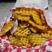 Half order of regular waffle fries with salt and pepper rub at Heavenly Buffaloes in Durham
