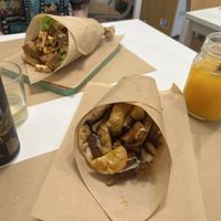Seitan gyros and their special greek pita with kombucha and fresh orange juice  at Peas in Athens
