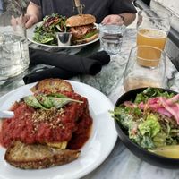 Huge portion of lasagna with sourdough garlic bread and caeser salad. So good!! My friend had the pulled shiitake sandwich and loved it.   at Hello 123 in Toronto