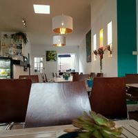 Light filled, music playing, indoor outdoor seating options..  at Nature Cafe/Bar in Frankston
