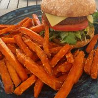 Southern style 'chicken' burger with sweet potato fries... amazing   at Nature Cafe/Bar in Frankston