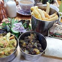 Jerk jackfruit wrap with fries, avocado slaw & mango & black bean salsa  at The Barn in Scorton
