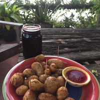 Jamaica juice and mini roasted potatoes with homemade red sauce  at Maracuya in Flores