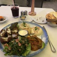 Vegan mezze platter served with Lebanese bread and bissap ( hibiscus) juice. Pickled carrots, olives and cucumber as crudite´  at Farid in Dakar
