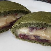 Sweet bun (mugwort flavor) filled with cream and red bean paste.
 at yummyyomil in Seoul