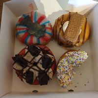Clockwise, starting top left: Queen Liz (limited edition for Platinum Jubilee), David Hasselhoff, Fairy Godmother (already ate half before taking the photo sorry), Liam Hemsworthy at Rodeo Doughnuts - Shaftesbury Ave in London