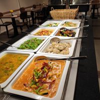 Hot food section of the buffet (with a basket of special bread in the back and metal containers with fantastic dumplings in it) at Chimy's in Zurich