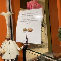 sign about portobello mushrooms as meat option   at Olive Oil Cafe in San Diego