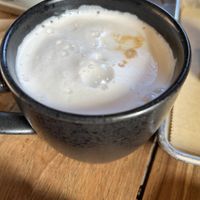 Latte with almond milk (too much foam!)  at Red Barn Bakery in Irvington