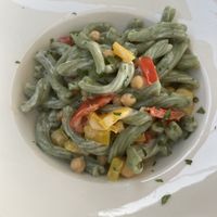 Spirulina pasta with roasted peppers and chickpeas in a coconut cream sauce. at Coogi's Restaurant in Mdina