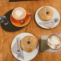 Latte, 2 salted peanut doughnuts and an iced latte  at Vegan Food & Sweet Bar in Brno