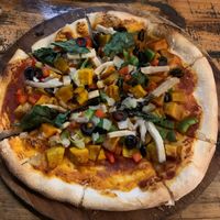 Vegan supreme pizza (pumpkin, mushrooms, bellpepper, onion, spinach, olives) at Chookie's Beer Garden in Ninh Binh