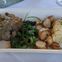 "surf and turf" vegan meatloaf made with impossible meat, and king oyster mushrooms with cauliflower mash and greens at Skopelos in Pensacola