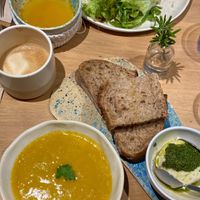 Breadless burger, soup of the day, bread with fake cheese and pesto sauce    at My Mother's Daughters  in Lisbon