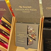 Dark Chocolate pizza with nuts and dried fruit at Wholesome Bee in Settle