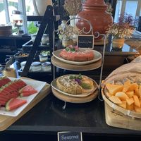 Part of the breakfast buffet - fresh fruit every day and usually something like a cake  at Away Chiang Mai Thapae Resort in Chiang Mai