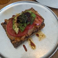 Open foccacia with cashew cheese at Oh My Goodness Specialty Breads in Hastings