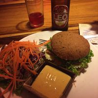 Tempeh burger, blueberry kombucha, and a beer at Ethos in Bangkok
