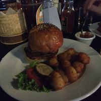 Bean burger with pineapple salsa in a toasted bun with tata tots. Absolutely perfect, very chill vibe, beautiful outdoor terrace with blankets if you get chilly. at Boss Burger in Luang Prabang