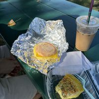 iced vanilla latte w/ oat milk (with coffee ice cubes so it doesn’t get watered down!!!) breakfast sandwich w/ vegan egg and chao cheese, and vegan frittata ☺️🩷  at Way Cup Cafe in Holland