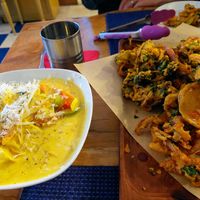 Yellow curry and vast pakora tray at The Red Dot Kitchen in Wurtsboro