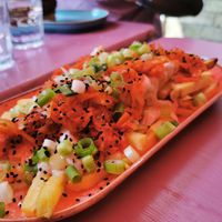 Kimchi- Kraut Fries: limited Edition Ferment - Air-fried fries loaded with our kimchi-kraut, miso mayo, topped with spring onions, fresh lime juice, chilli flakes and sesame seeds. at DoppleGanger in Cambridge