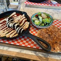 Plant-Based Shakshuka with falafel balls, pita bread and side salad  at  Cafe Landwer in Vaughan