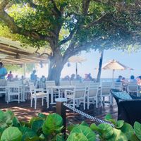 Outdoor seating  at Cotton House Beach Cafe in Mustique