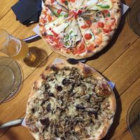 Murciana pizza and Funghi pizza both with vegan cheese at Lopez and Lopez in Madrid