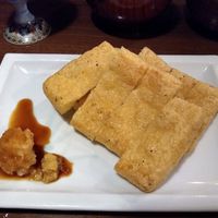 Fried tofu skins with wasabi and radish garnish at Itoya in Matsumoto