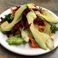 Colorful salad with beets, carrots, cucumber, avocado, lettuce, and house made dressing at Soy Salud in Guerrero Negro