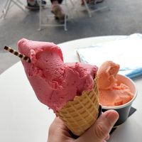 Raspberry sorbet with blood orange in the background at Black Peak Gelato in Wanaka
