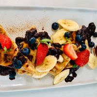 Banana waffles with berries!  So yummy! at The Kitchen in Nelson