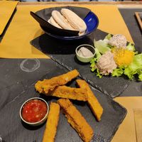 Panelle e tigelle con tris di hummus at OH Ficomaeco in Brescia