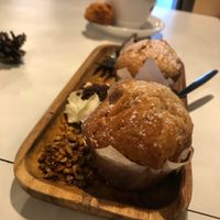 Strawberry muffins served with cream and granola made from beer grains at InStock in The Hague