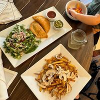 Vegan empanadas, mushroom fries, and a fruit cup for my son at Santa Fe Oxygen and Healing Bar Apothecary in Santa Fe