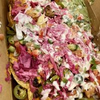 Loaded Nachos to-go - it looks messy, but don’t let that fool you, it’s flavorful and delicious  at Sage Regenerative Kitchen in Pasadena