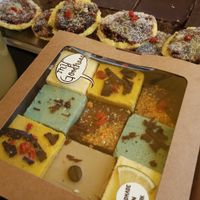 Raw cakes at the My Goodness market stall. Raw vegan truffles, raw vegan mince pies, peanut butter power bars.  at My Goodness in Cork