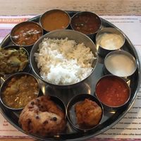 Vegan thali set menu (dosa and poppadom removed to show dishes) at Dosa Kitchen in Newcastle Upon Tyne