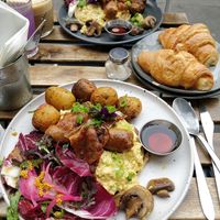 Breakfast Pancakes with scrambled Tofu, rice paper "bacon" and Patatas bravas. at Aujourd'hui Demain Cafe in Paris
