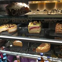 Too full to try a slice of cake. We need to come back  at Aujourd'hui Demain Cafe in Paris