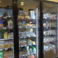 Four fridges of vegan cheeses!! at Aujourd'hui Demain Cafe in Paris