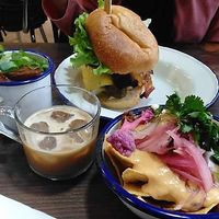 Burgers, nachos, and coffee  at Aujourd'hui Demain Cafe in Paris