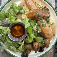 Brunch plate: pancakes, sausage, scrambled eggs  at Aujourd'hui Demain Cafe in Paris
