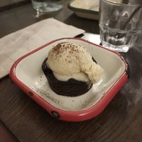 Mi-cuit au chocolat noir: pretty much burned😒and the vanilla ice cream was rather boring at Aujourd'hui Demain Cafe in Paris